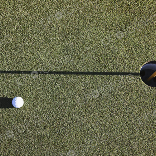 White Golf Ball Near the Cup White Golf Ball Near the Cup