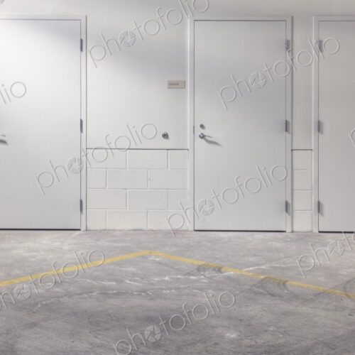 White doors in parking lot.