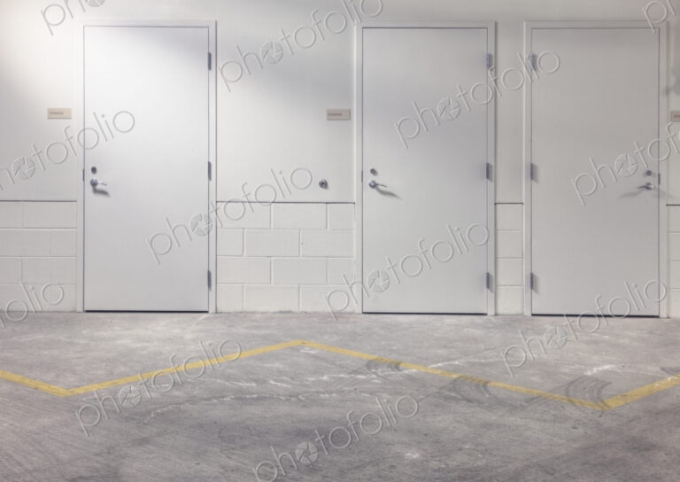 White doors in parking lot.