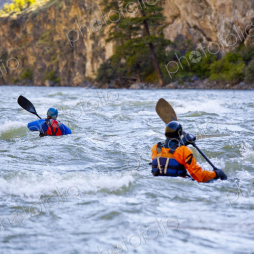 Whitewater Kayakers paddling the choppy fast flowing waters of Impassable Canyon on…