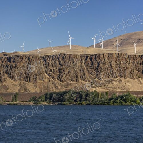 Wind turbines line the hills above the Columbia River Gorge, seen from the Oregon side… Wind turbines line the hills above the Columbia River Gorge, seen from the Oregon side…