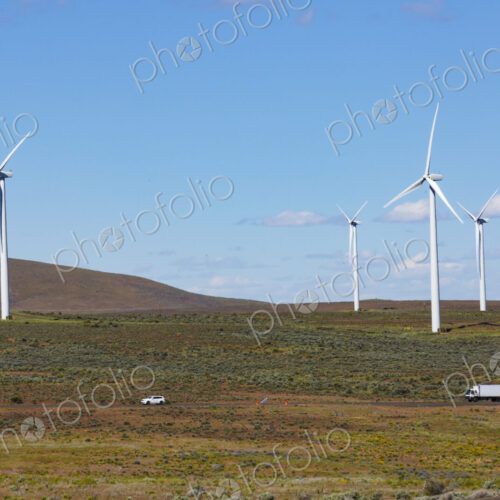 Wind turbines on the rolling hills of Kittikas county in Washington state, tall white… Wind turbines on the rolling hills of Kittikas county in Washington state, tall white…