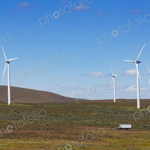 Wind turbines on the rolling hills of Kittikas county in Washington state, tall white… Wind turbines on the rolling hills of Kittikas county in Washington state, tall white…