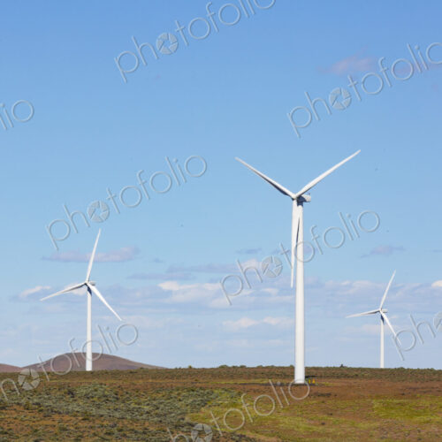 Wind turbines on the rolling hills of Kittikas county in Washington state, tall white… Wind turbines on the rolling hills of Kittikas county in Washington state, tall white…