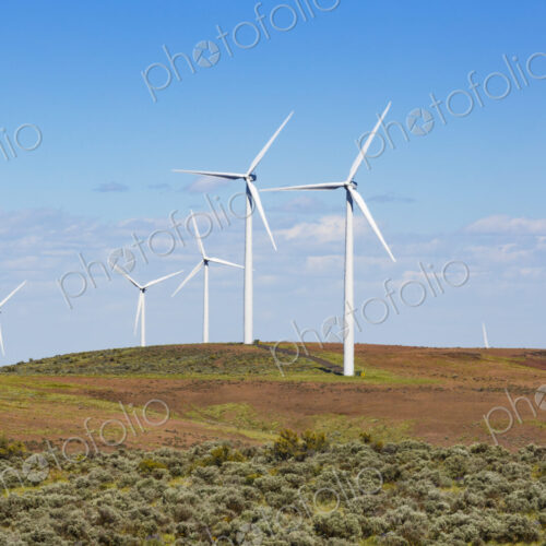Wind turbines on the rolling hills of Kittikas county in Washington state, tall white… Wind turbines on the rolling hills of Kittikas county in Washington state, tall white…