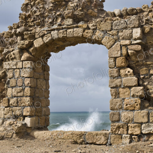 Window in Ruin Wall Showing the Mediterranean Sea Window in Ruin Wall Showing the Mediterranean Sea