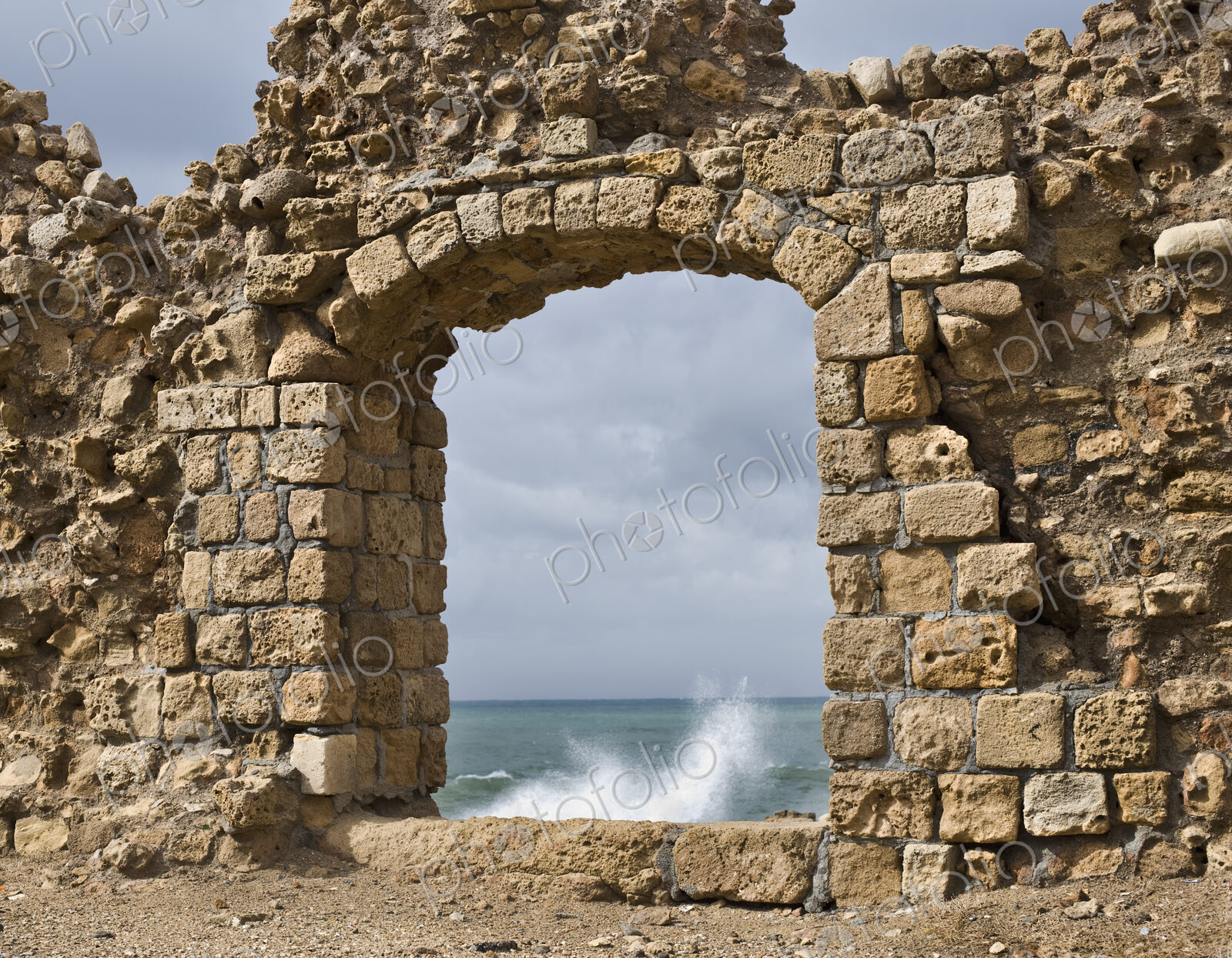Window in Ruin Wall Showing the Mediterranean Sea