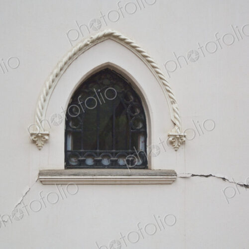 Window in a Cracked Building Wall Window in a Cracked Building Wall