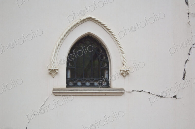 Window in a Cracked Building Wall