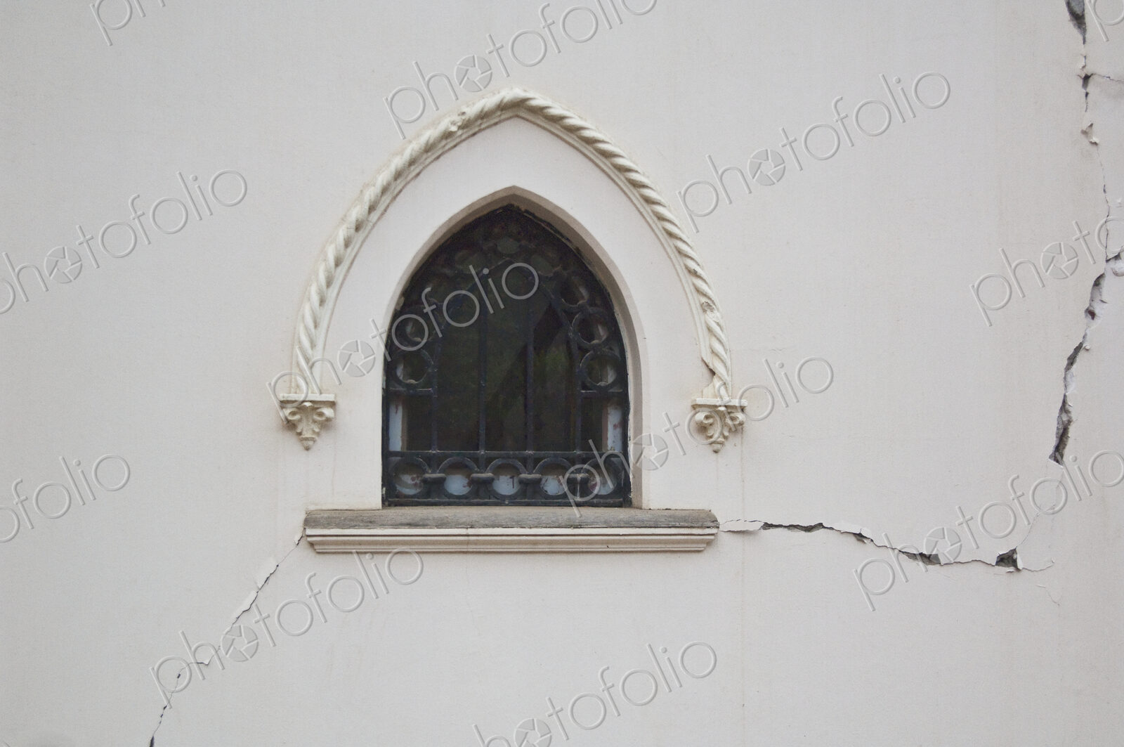 Window in a Cracked Building Wall