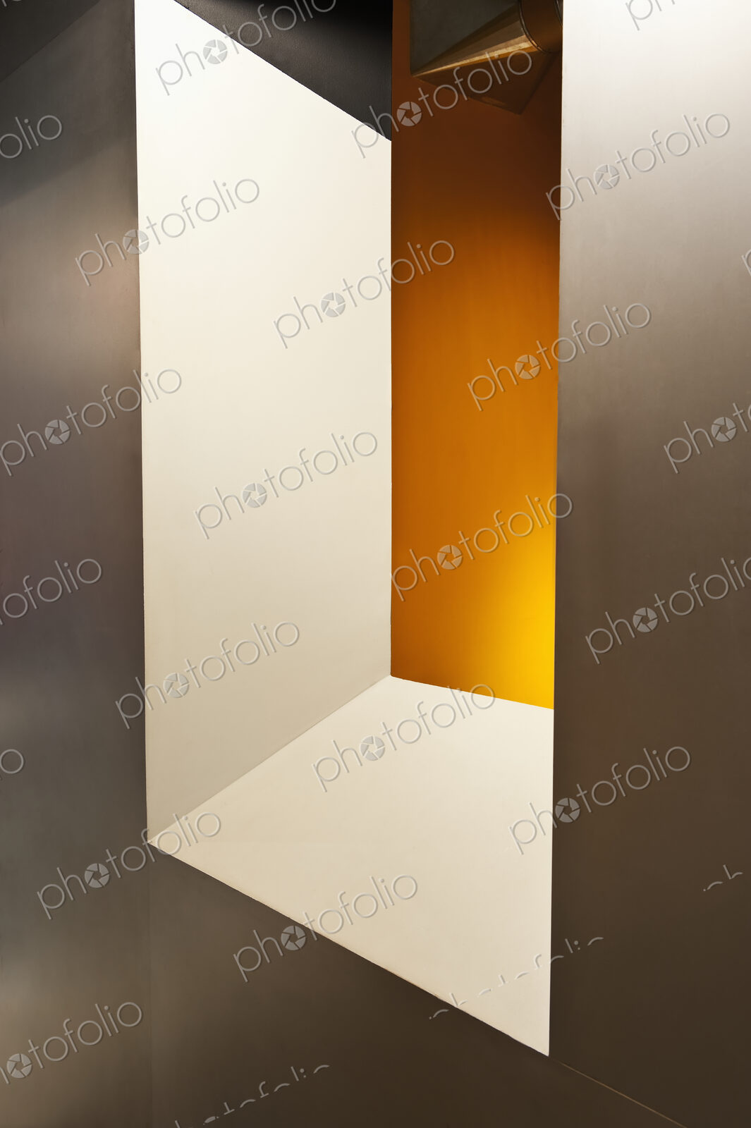 Window onto yellow wall.