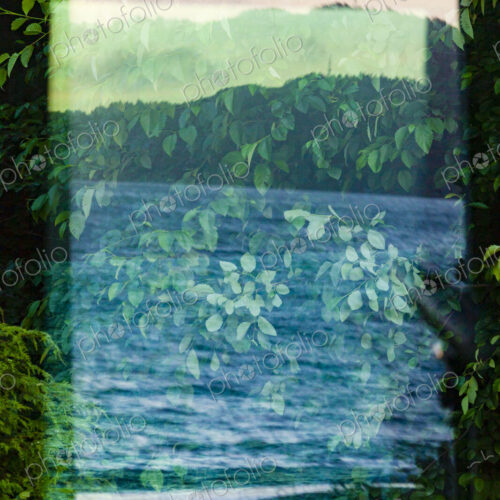 Window reflection of the forest, mountains and moving water. Window reflection of the forest, mountains and moving water.