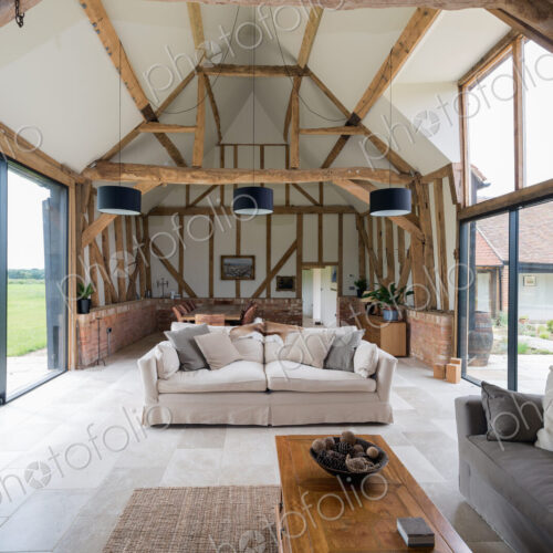 Windows and sofa in modern living room Windows and sofa in modern living room
