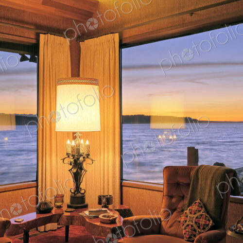 Windows in modern living room over ocean view