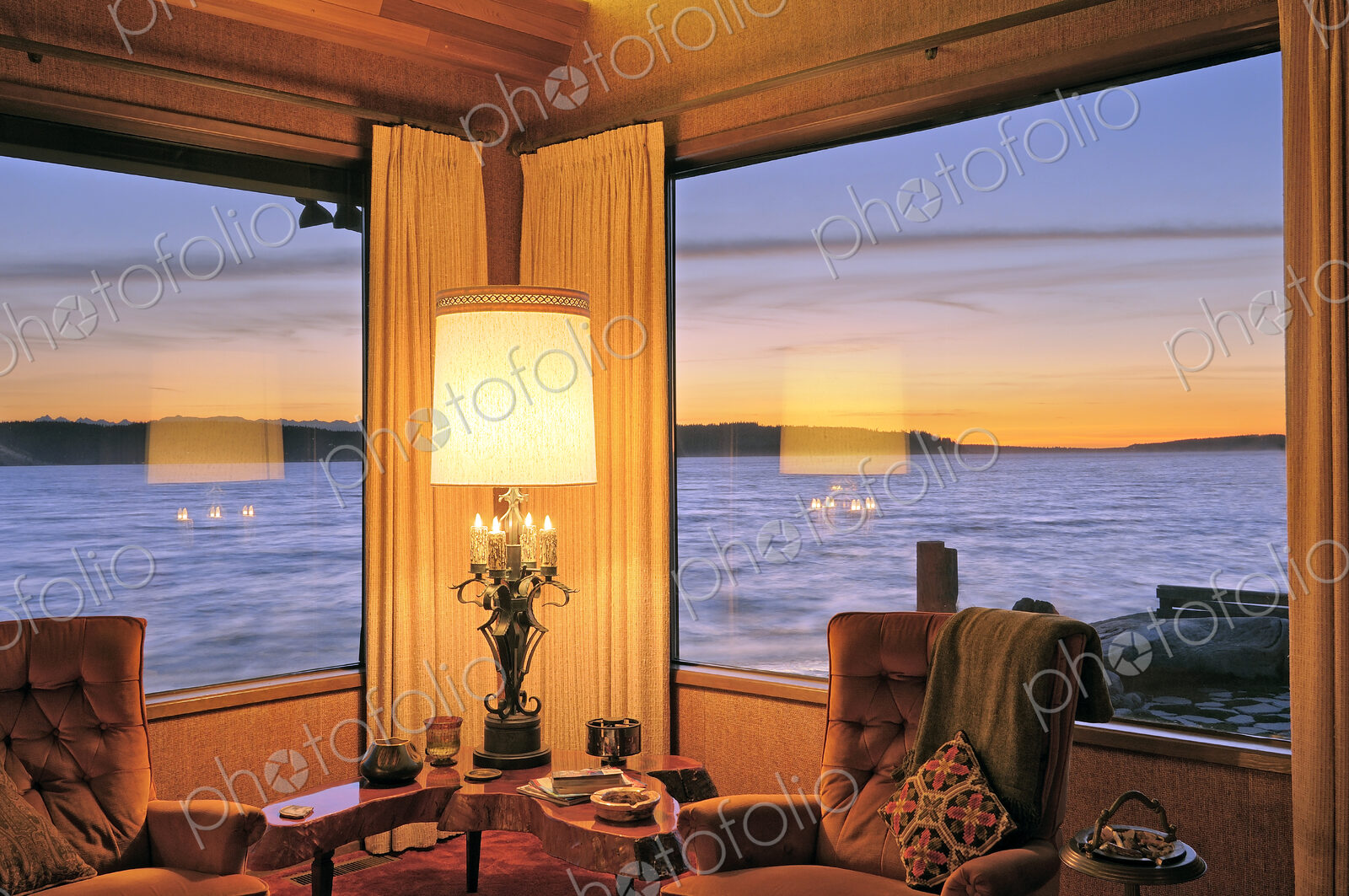 Windows in modern living room over ocean view