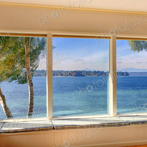 Windows to ocean view in modern living room