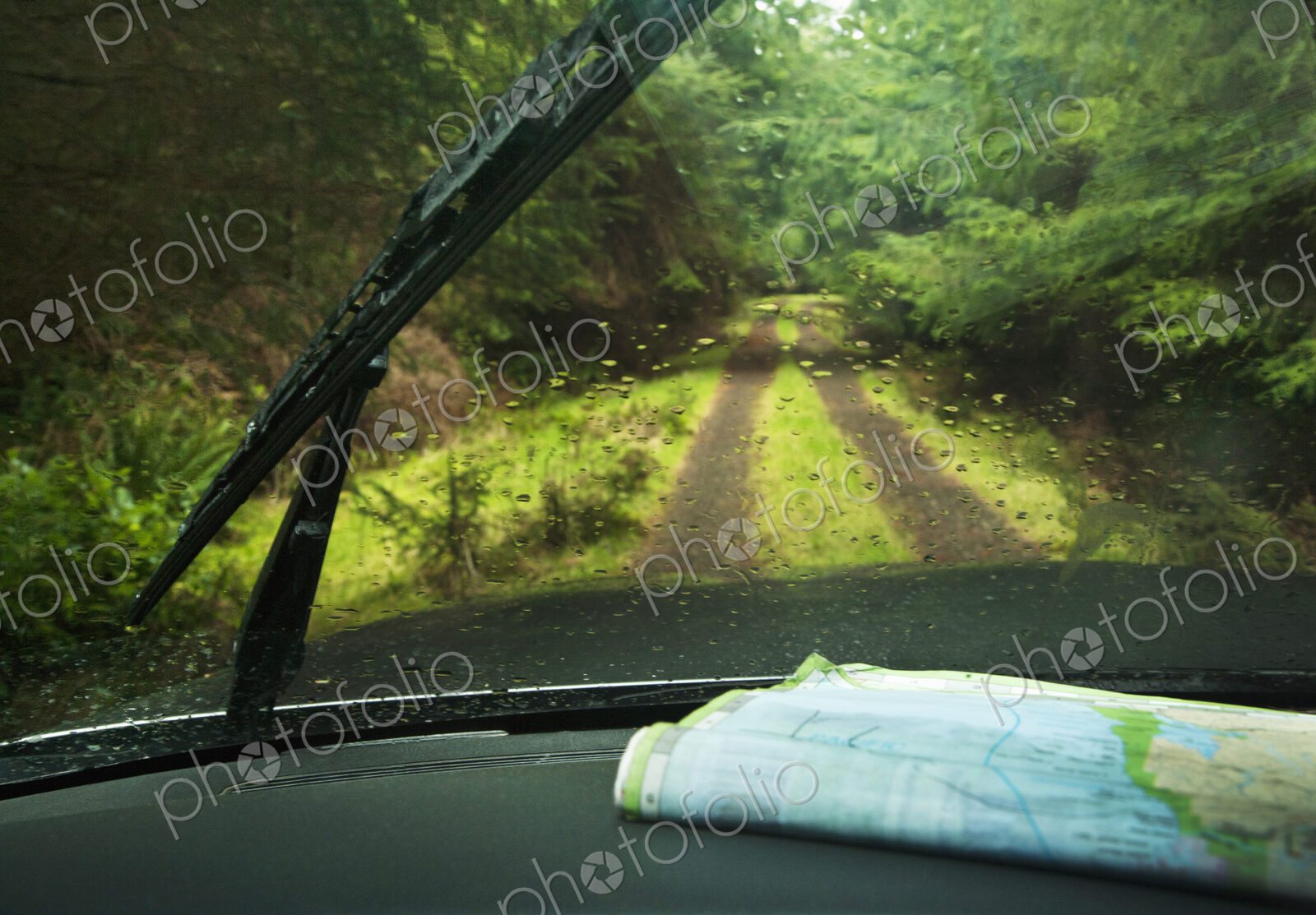 Windshield wipers and map on dashboard of car