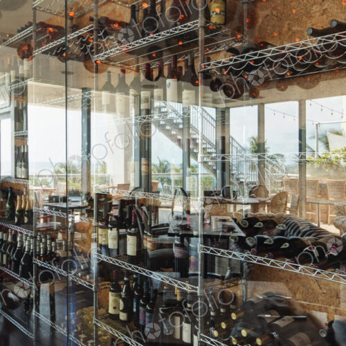 Wine bottles on shelves in restaurant Wine bottles on shelves in restaurant