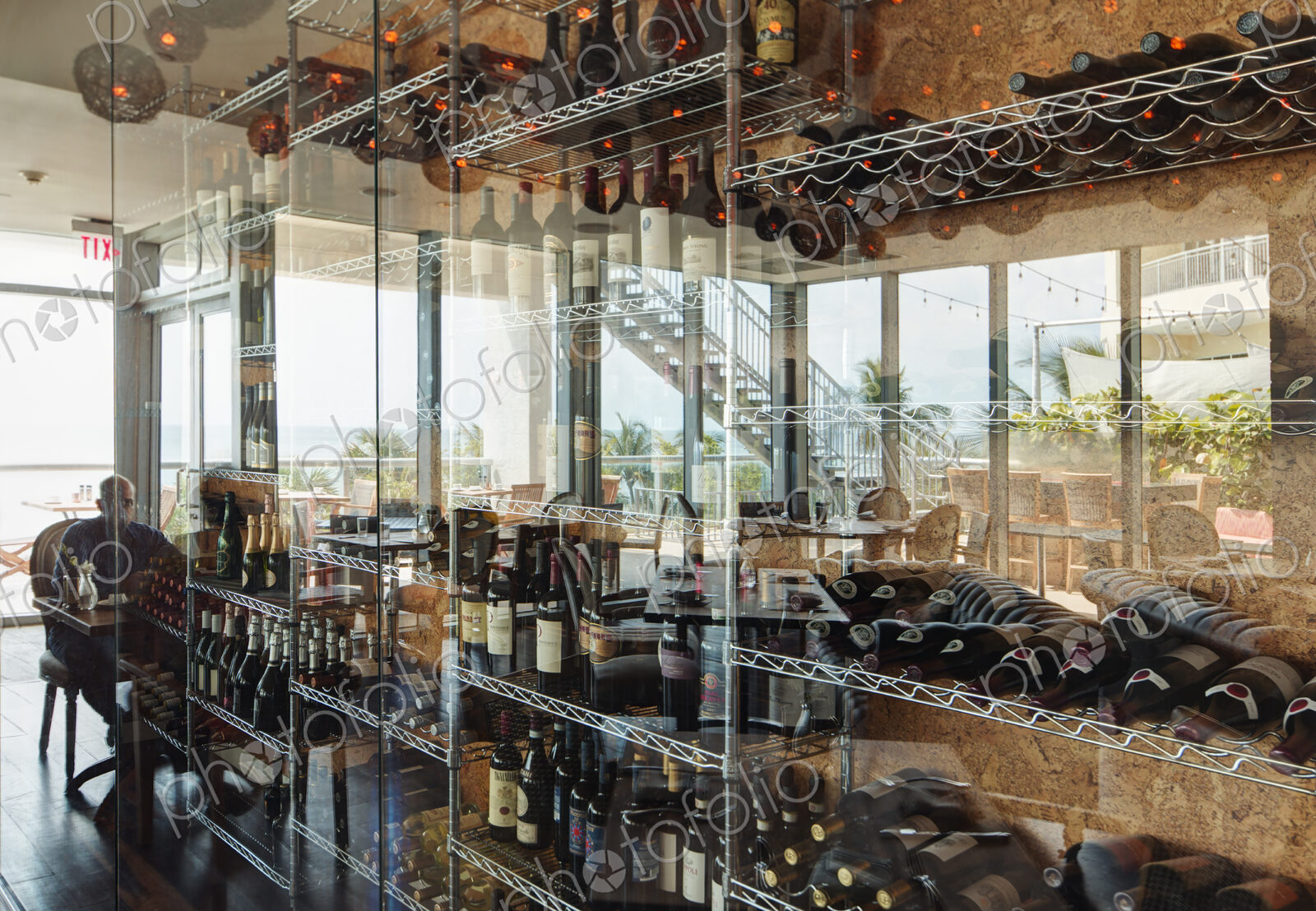 Wine bottles on shelves in restaurant