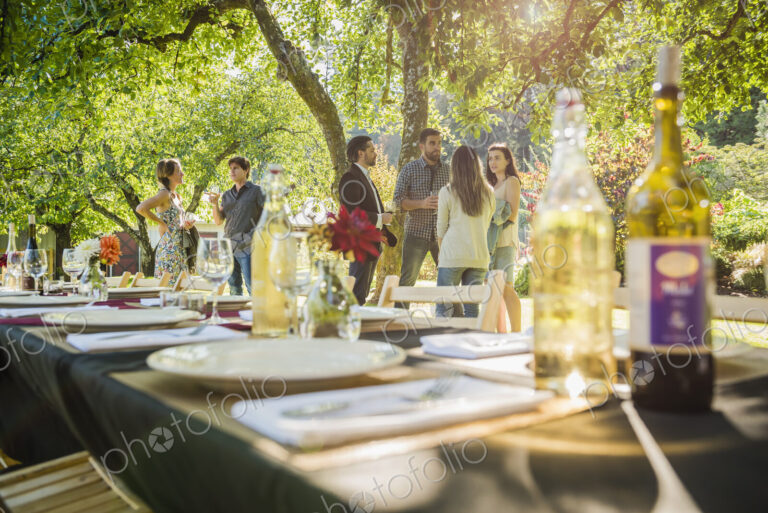 Wine bottles on table at party outdoors