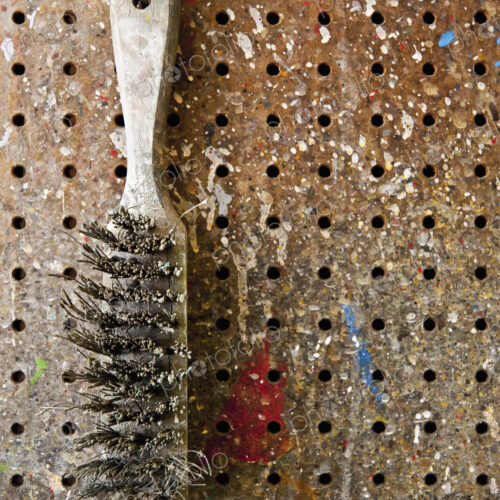 Wire Brush Hanging On a Pegboard Wire Brush Hanging On a Pegboard