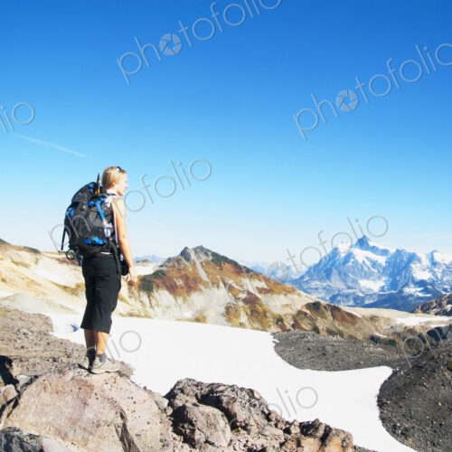 Woman admiring mountains in remote landscape