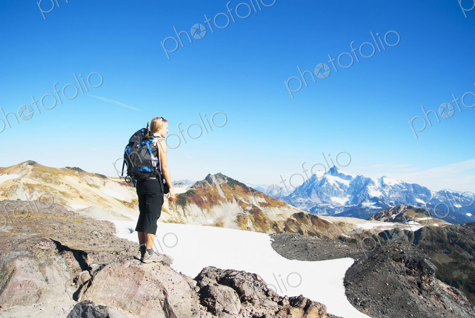 Woman admiring mountains in remote landscape