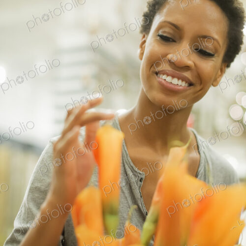 Woman arranging flowers at home Woman arranging flowers at home