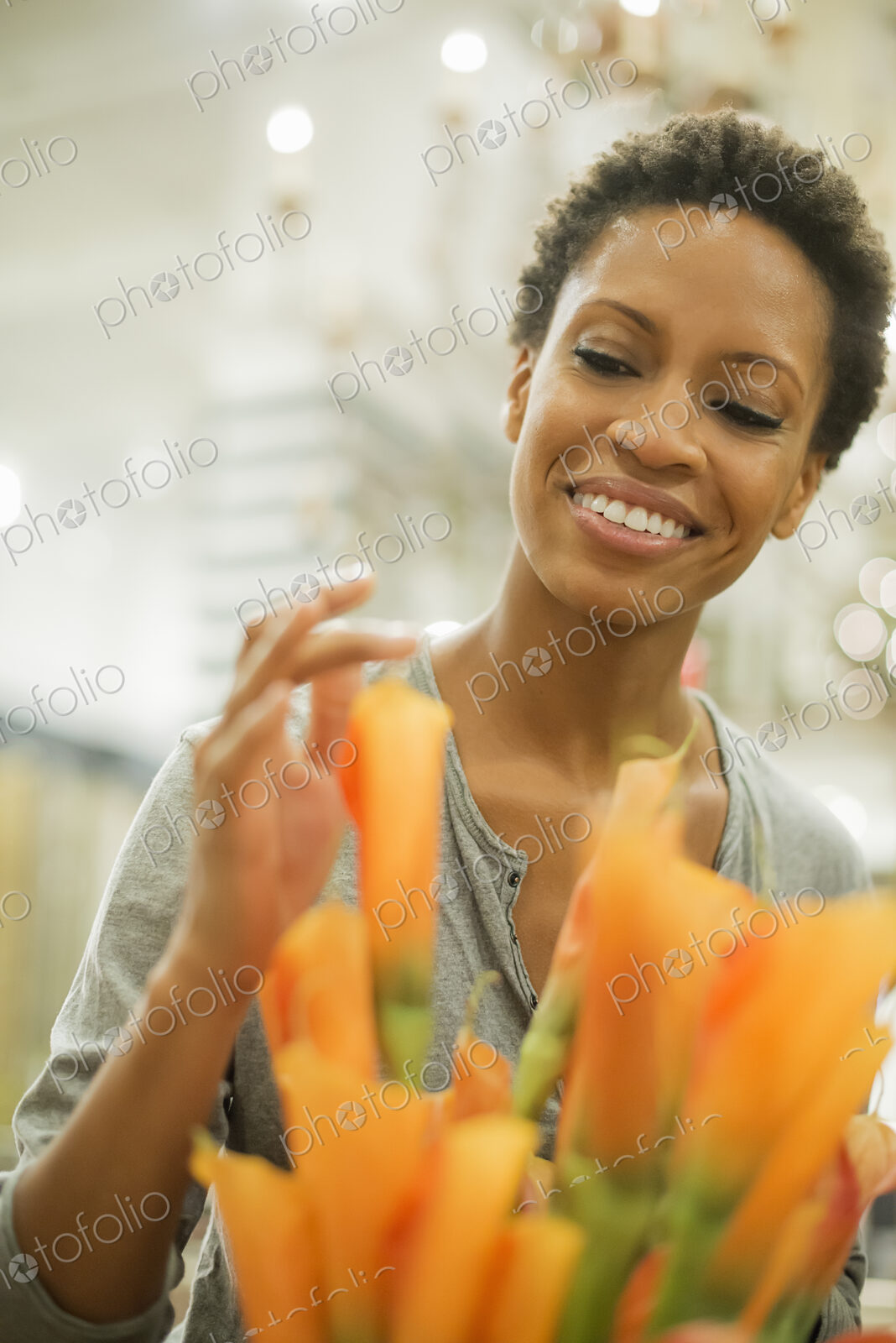 Woman arranging flowers at home