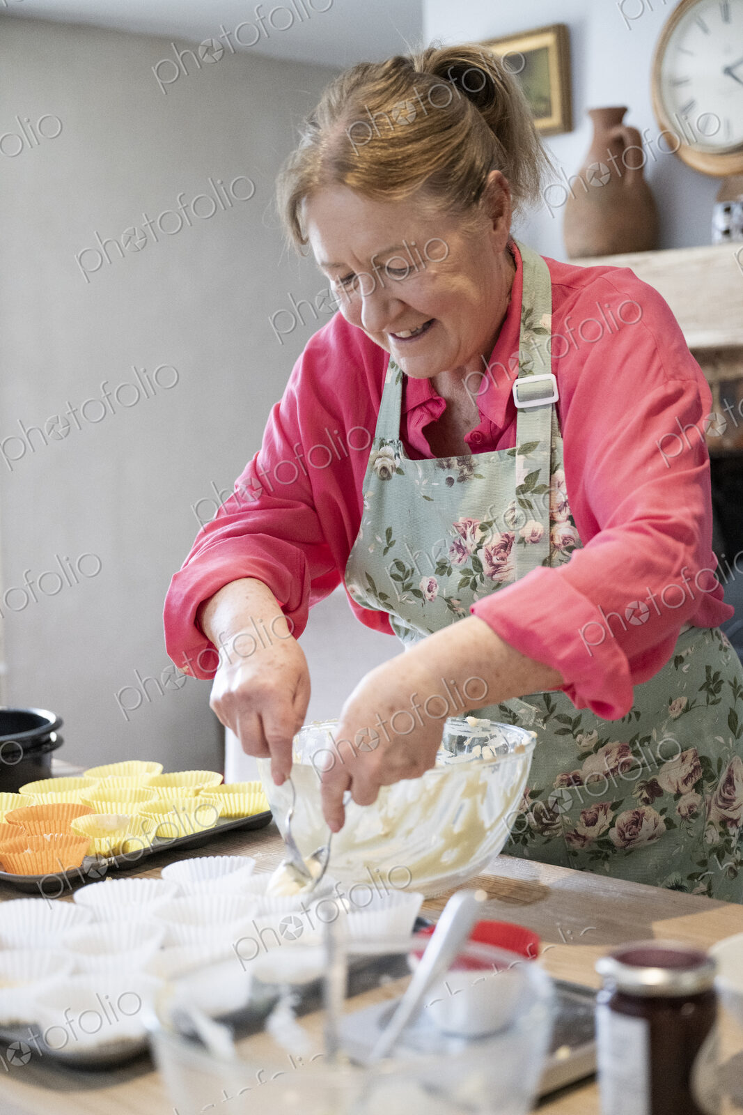 Woman baking cake in kitchen.