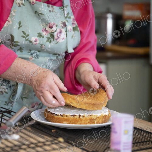 Woman baking cake in kitchen.