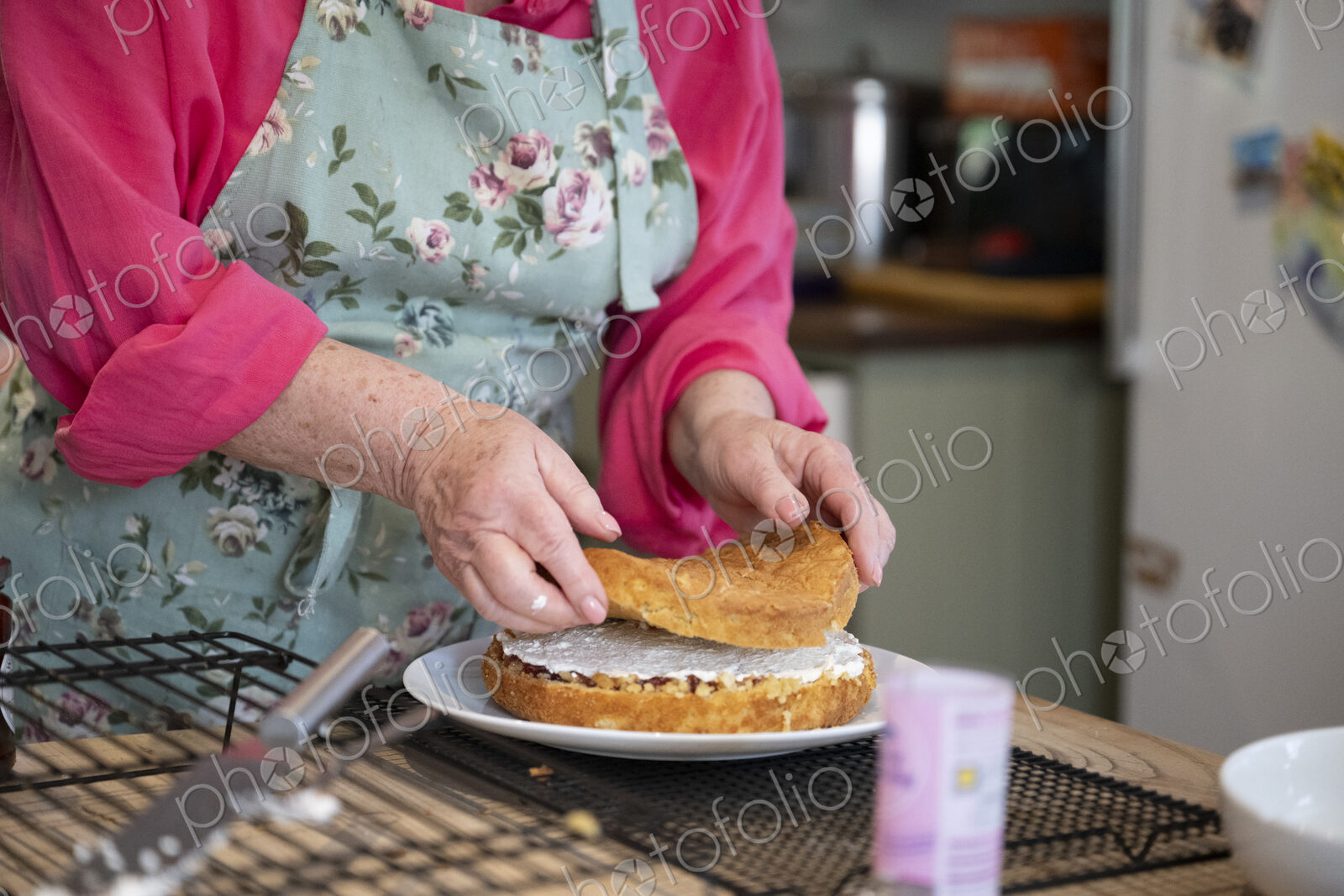 Woman baking cake in kitchen.