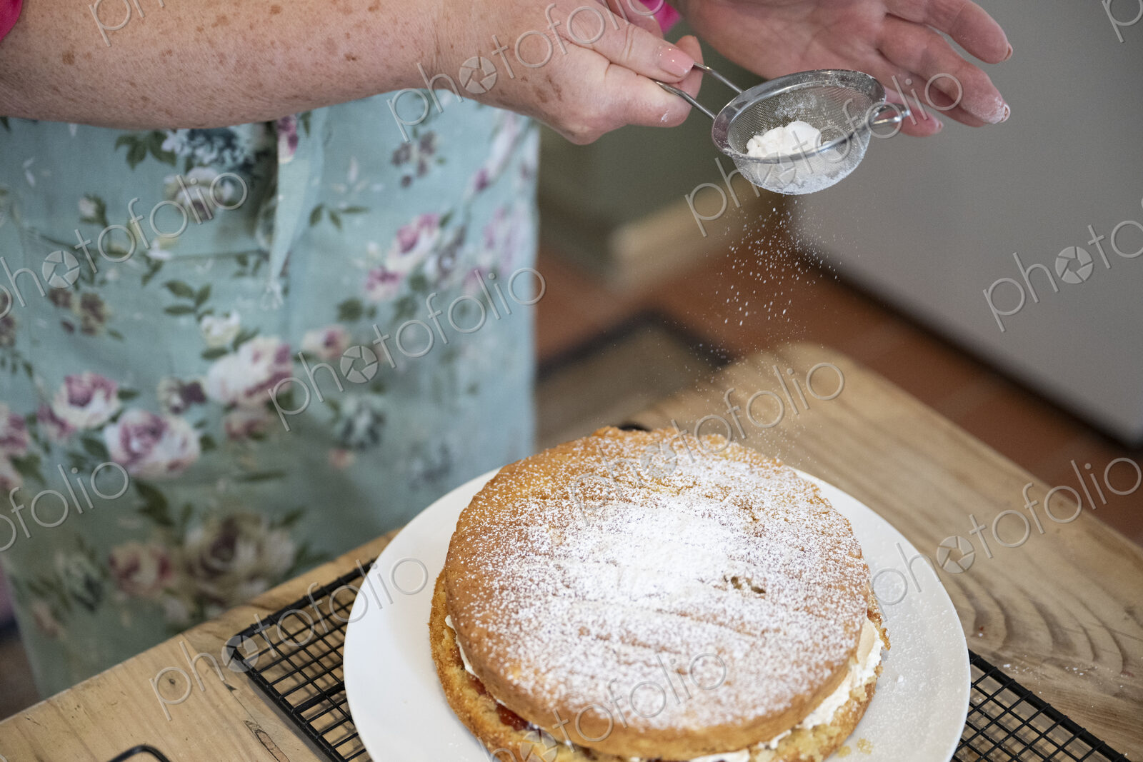 Woman baking cake in kitchen.