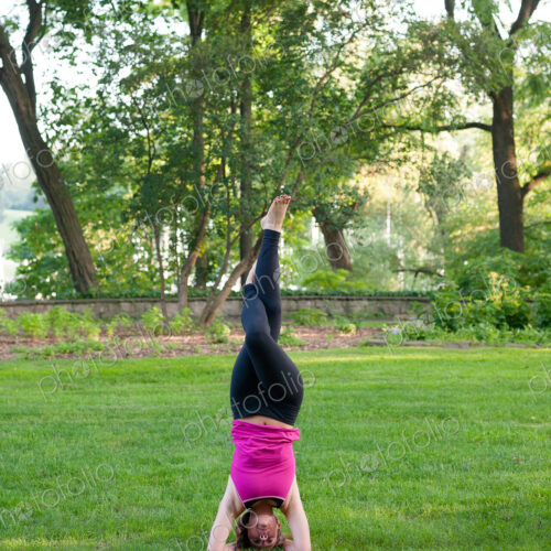 Woman balancing in yoga pose in park. Woman balancing in yoga pose in park.