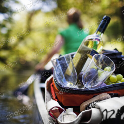 Woman canoeing with picnic Woman canoeing with picnic