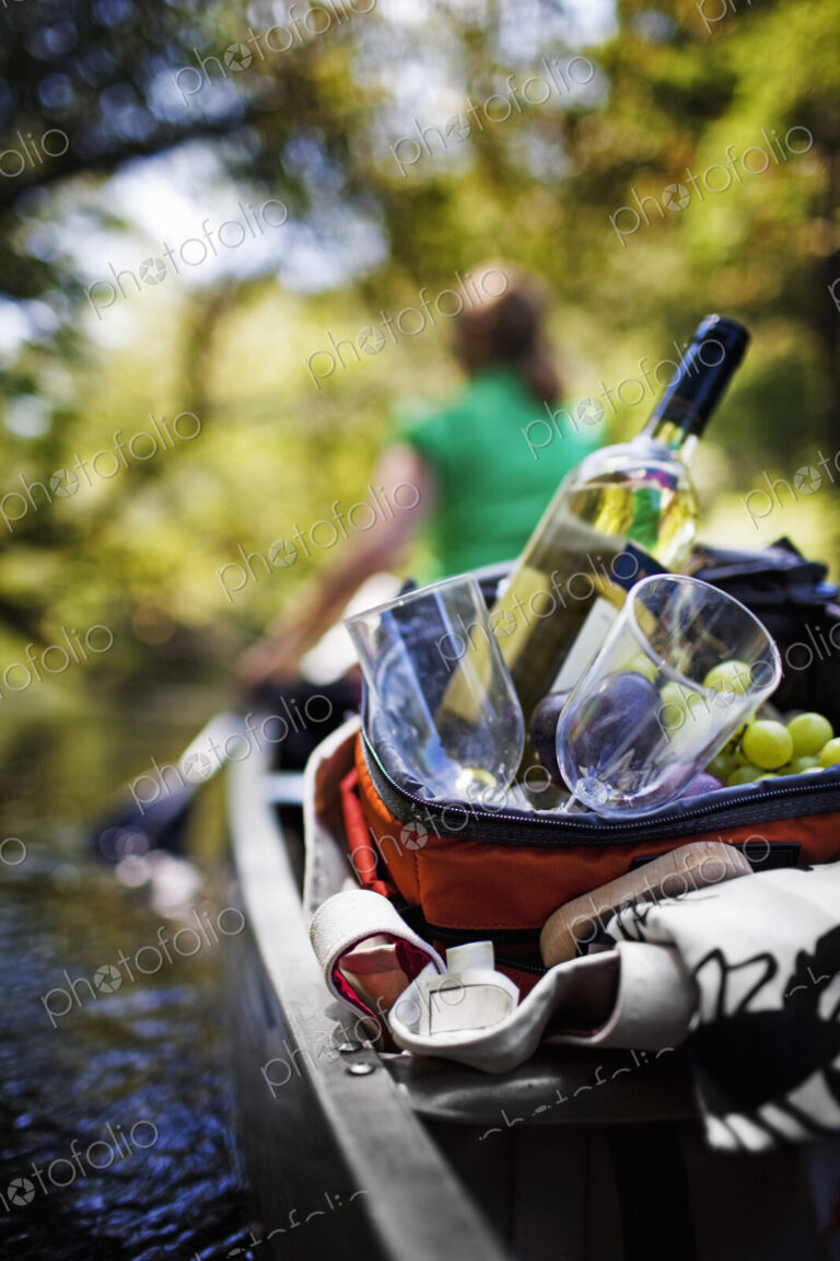 Woman canoeing with picnic