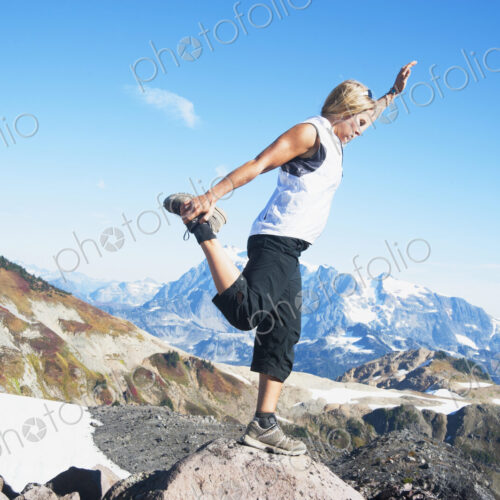 Woman doing balancing yoga pose on Mount Baker, Snoqualmie National Forest, North… Woman doing balancing yoga pose on Mount Baker, Snoqualmie National Forest, North…