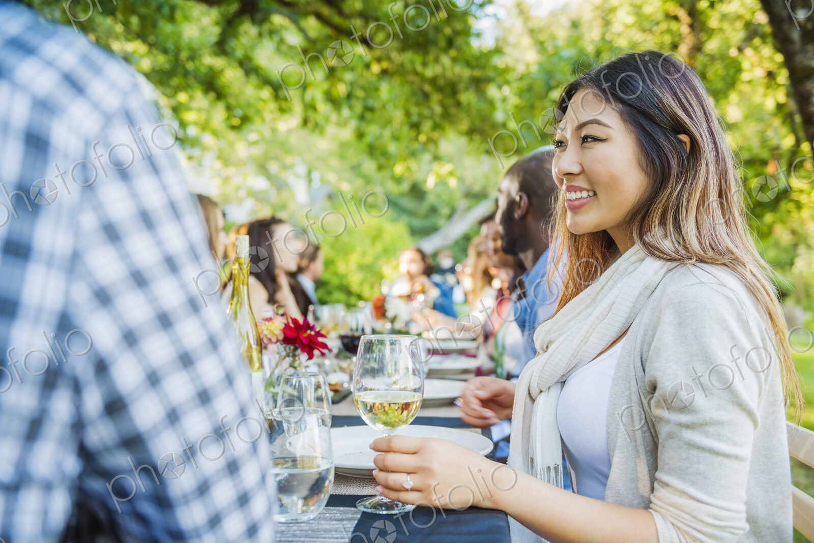 Woman enjoying wine at party outdoors