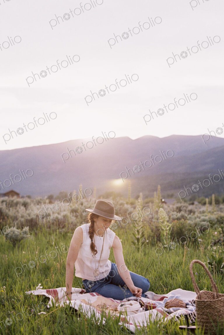 Woman having a picnic on a meadow.