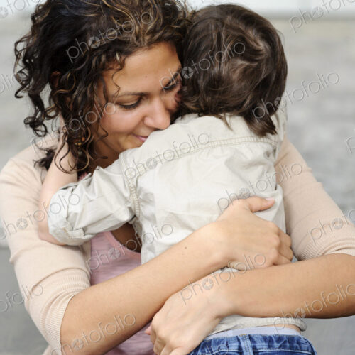 Woman hugging a boy, mother and sun. Woman hugging a boy, mother and sun.