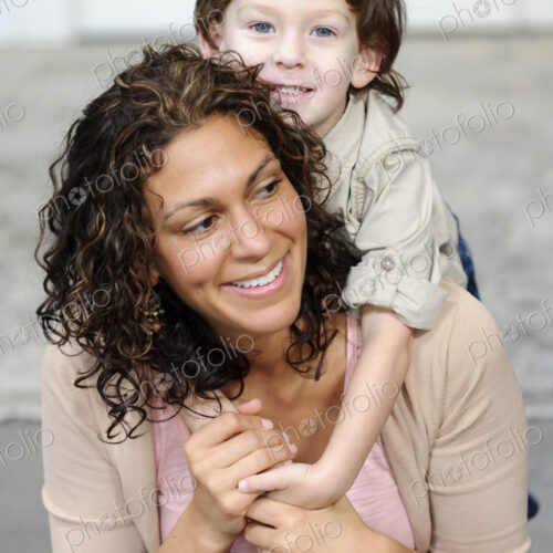 Woman hugging a boy, mother and sun laughing. Woman hugging a boy, mother and sun laughing.