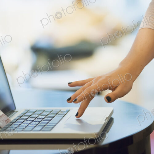 Woman on-line shopping on laptop