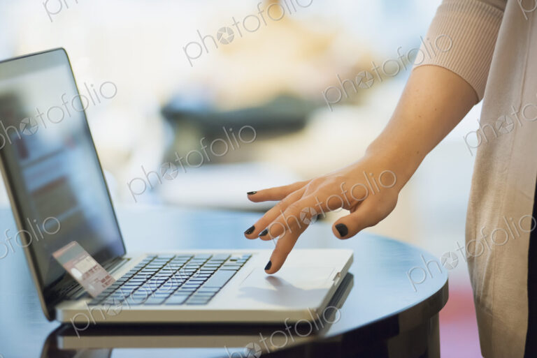 Woman on-line shopping on laptop