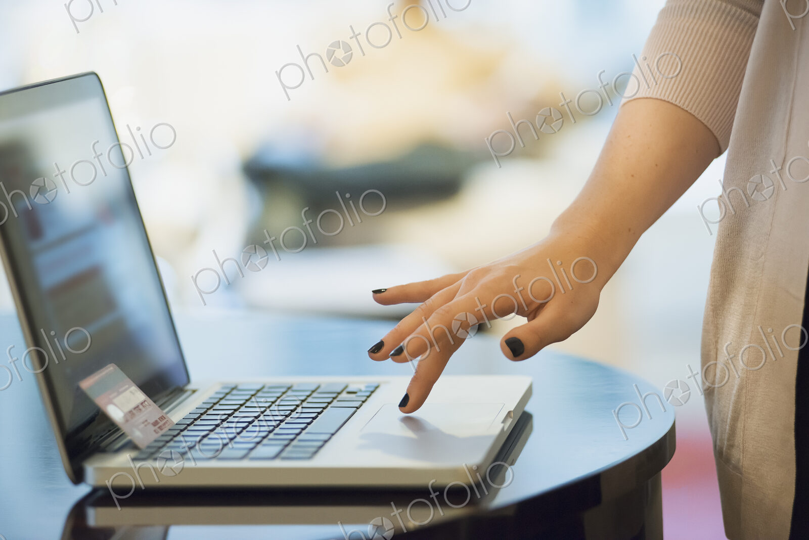 Woman on-line shopping on laptop