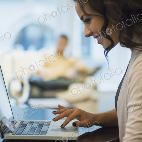Woman on-line shopping on laptop