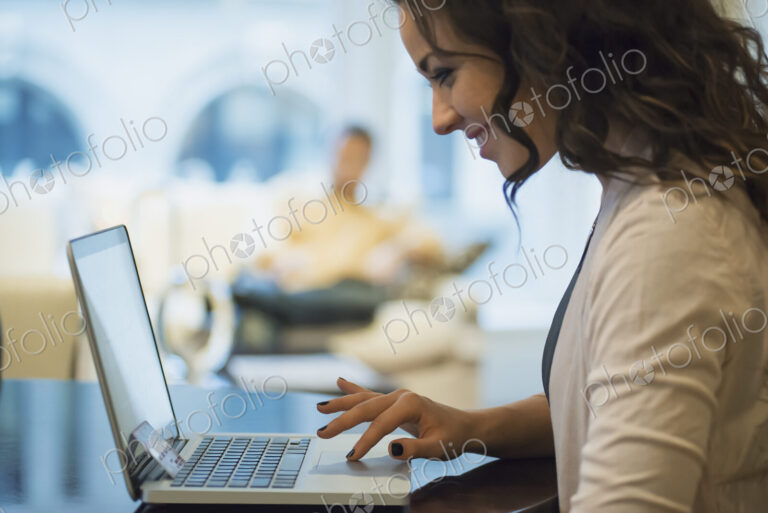 Woman on-line shopping on laptop