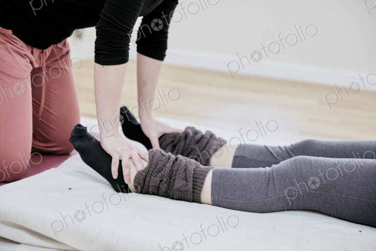Woman receiving a Thai massage on her feet