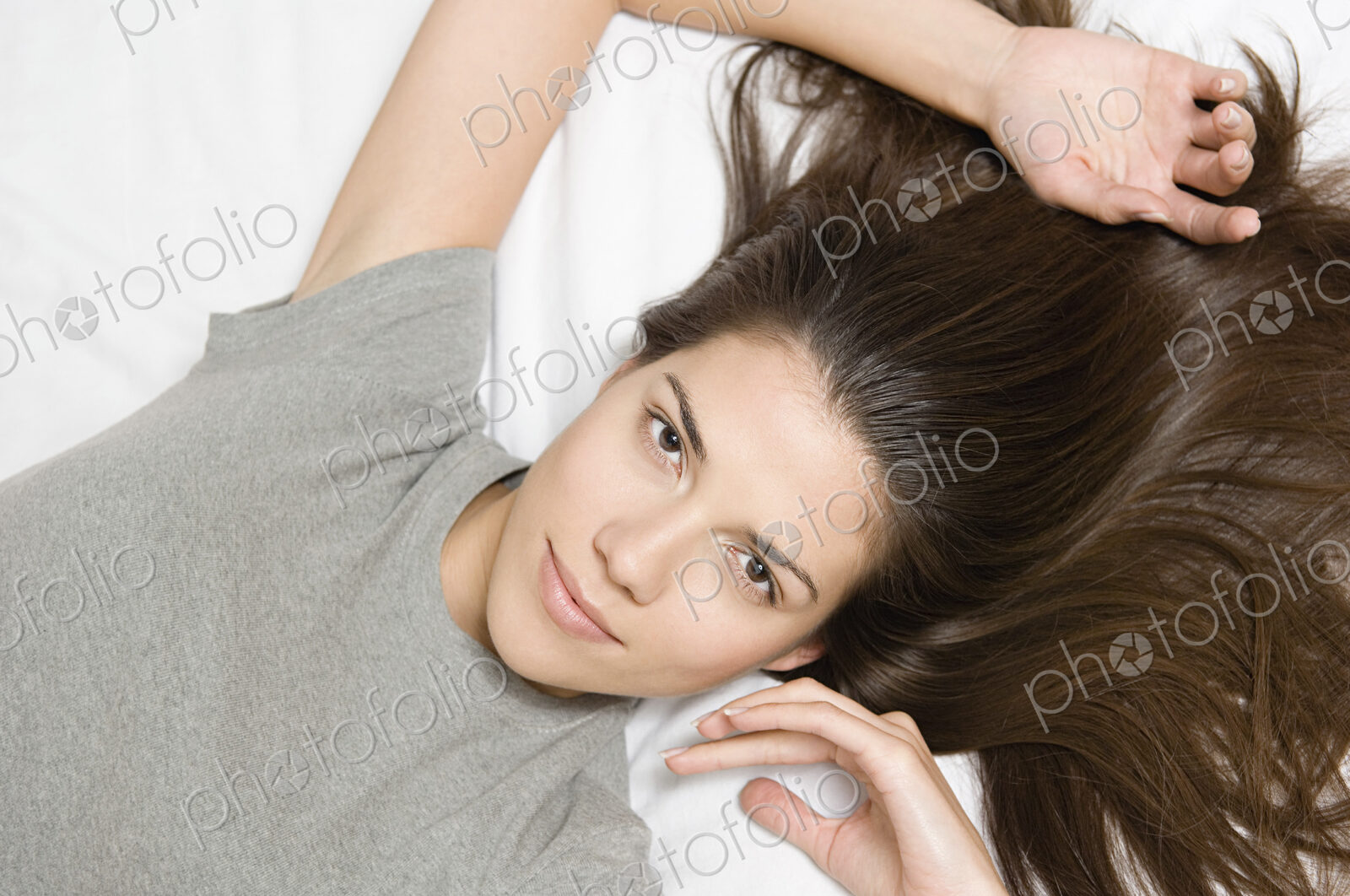 Woman reclining looking up at camera.