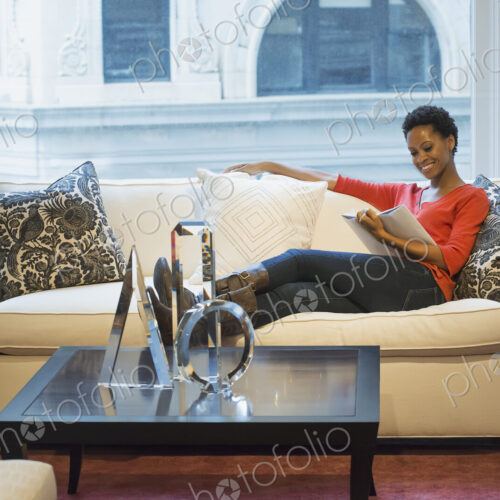Woman relaxing at home reading