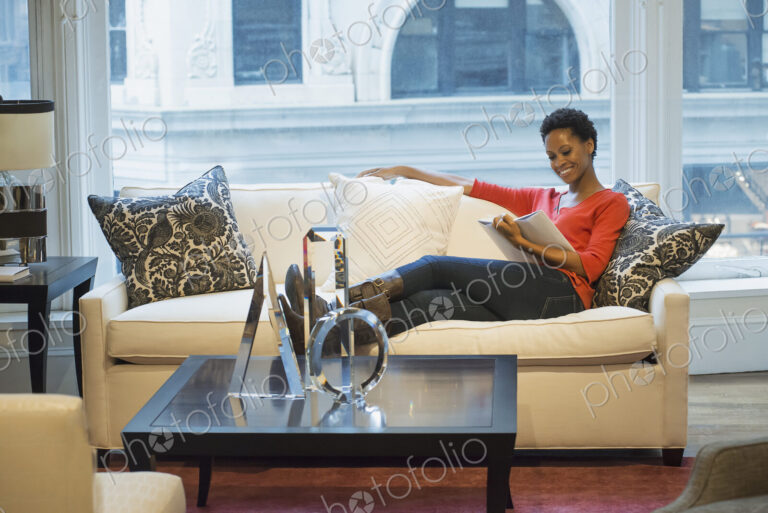 Woman relaxing at home reading